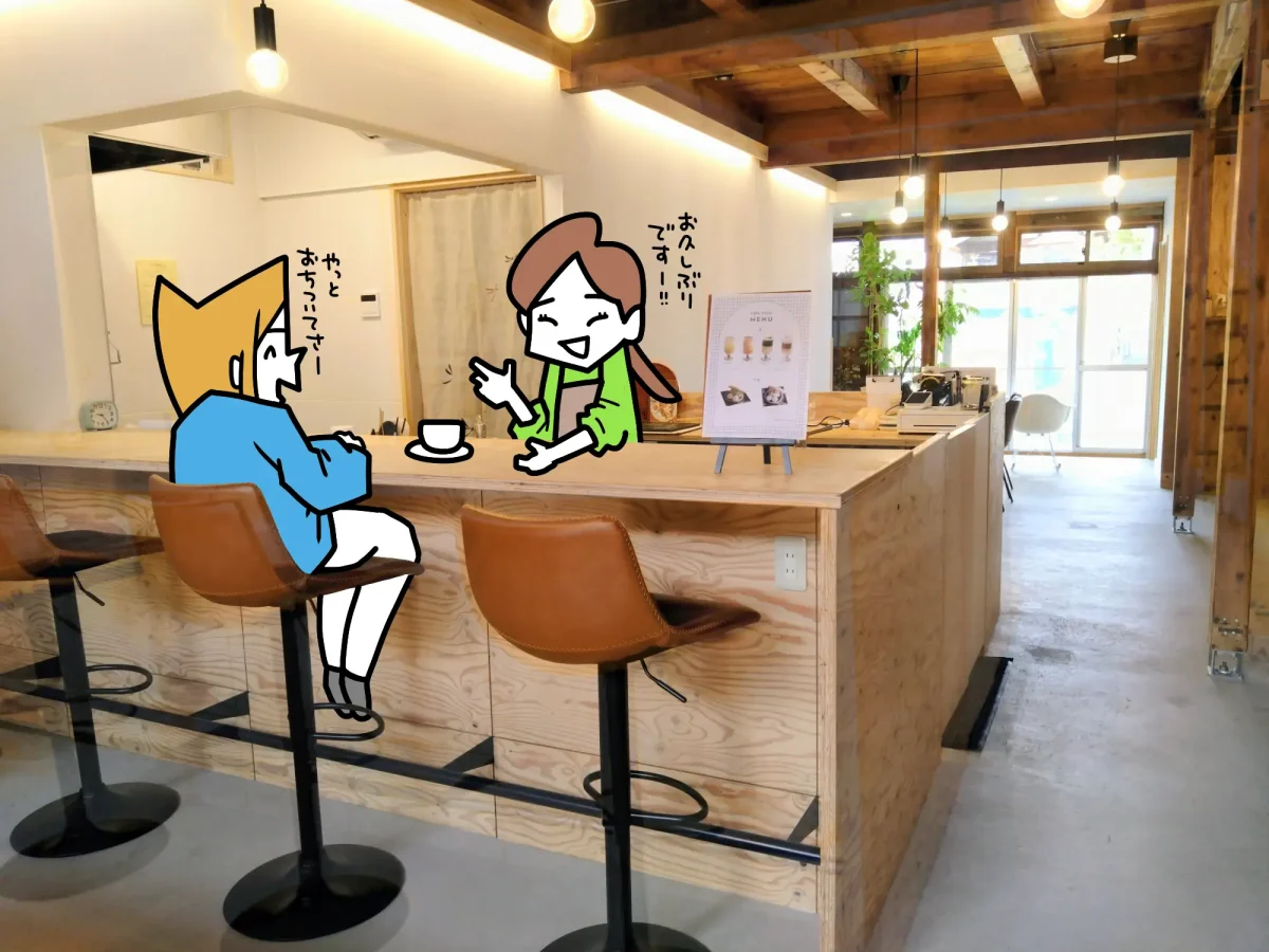 カウンターで店主と会話する様子